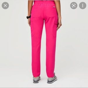 Shocking pink skinny scrub pants